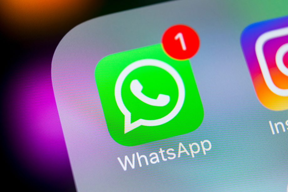Logo for WhatsApp shown on a phone screen